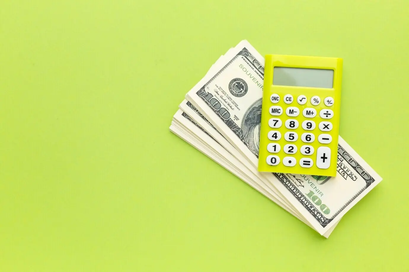 Overhead view of a calculator and a cash frame